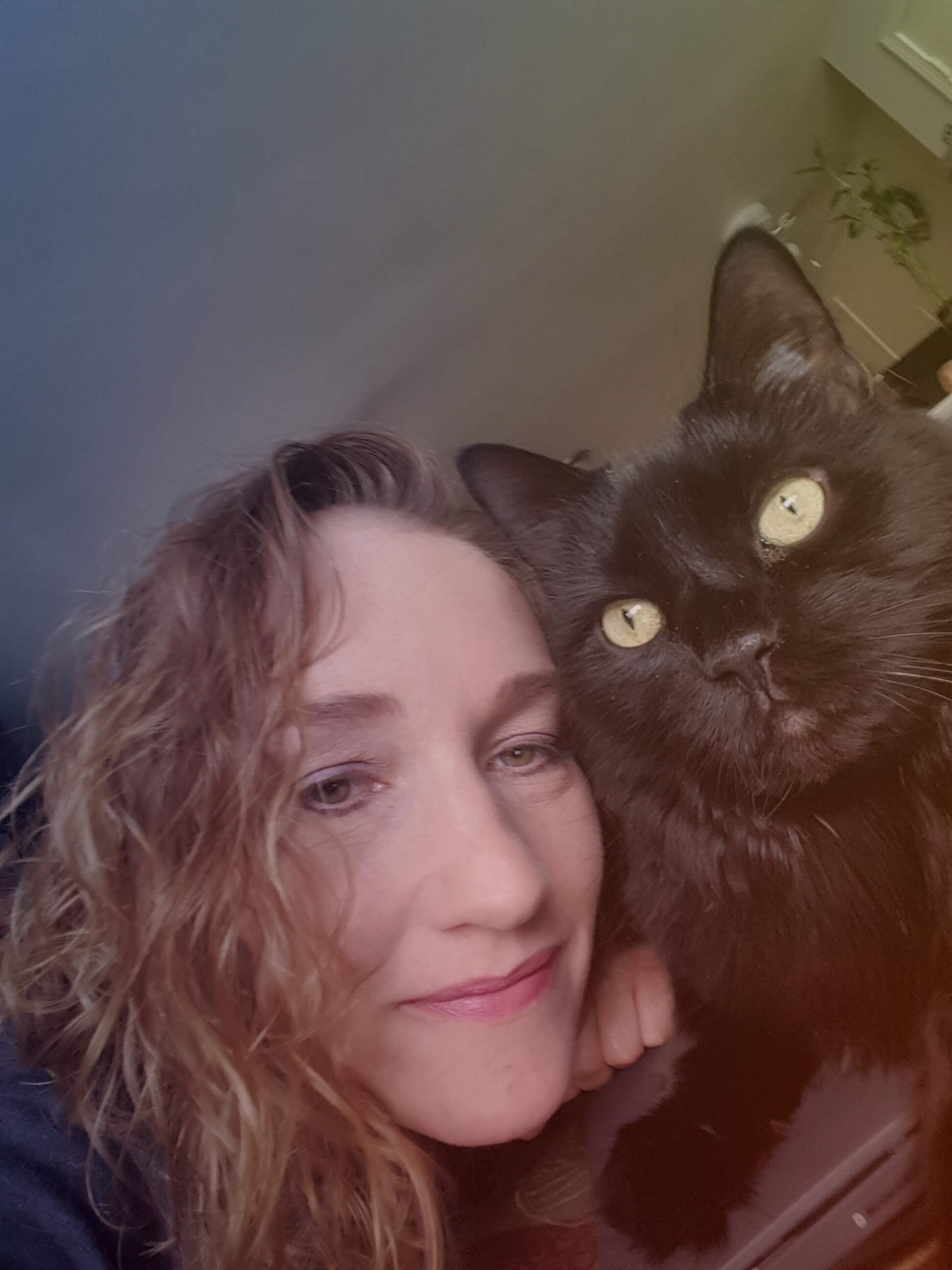 Holly Janes and her black cat, Baby